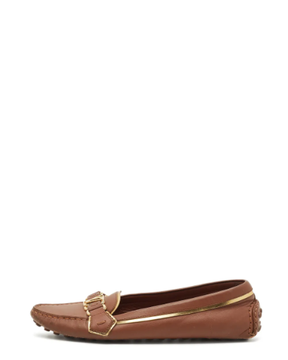 Elegant brown leather slip-on loafers featuring a signature gold-tone LV logo plaque, refined gold-tone piping, a classic round toe, and a durable pebbled rubber sole for all-day comfort and timeless style.